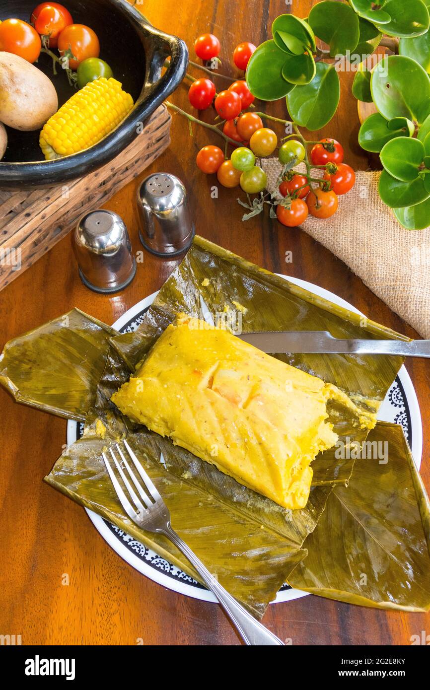 Colombian recipe steamed tamales cooked in banana leaves Stock Photo