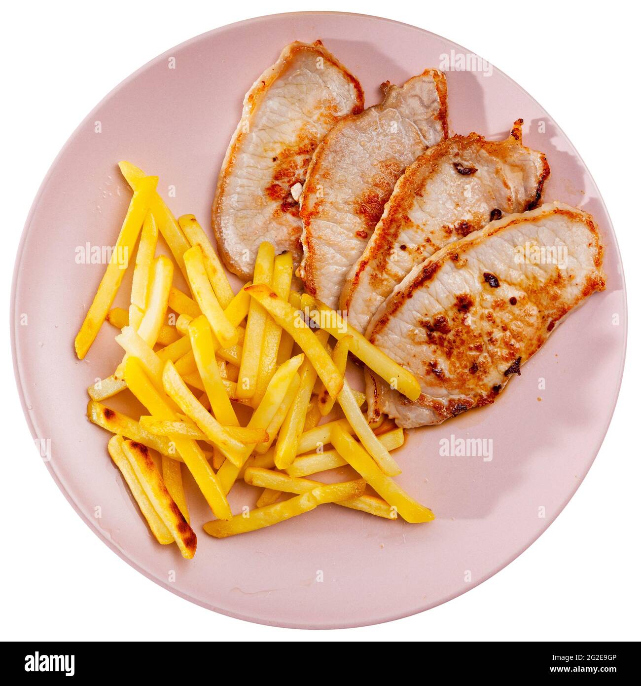Tasty hearty lunch of roasted steaks of pork loin served with fried potatoes Stock Photo