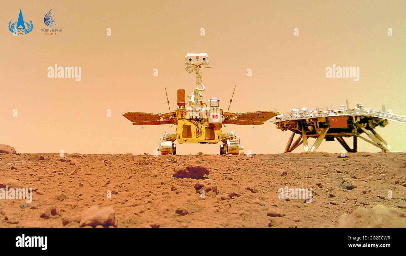 (210611) -- BEIJING, June 11, 2021 (Xinhua) -- Photo released on June 11, 2021 by the China National Space Administration (CNSA) shows a selfie of China's first Mars rover Zhurong with the landing platform. The China National Space Administration Friday released new images taken by the country's first Mars rover Zhurong, showing national flag on the red planet. The images were unveiled at a ceremony in Beijing, signifying a complete success of China's first mars exploration mission. The images include the landing site panorama, Martian landscape and a selfie of the rover with the landing Stock Photo