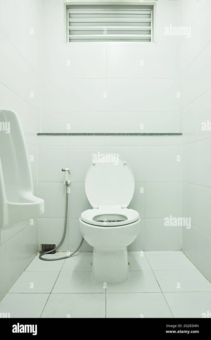 Toilet bowl with water spray Stock Photo - Alamy