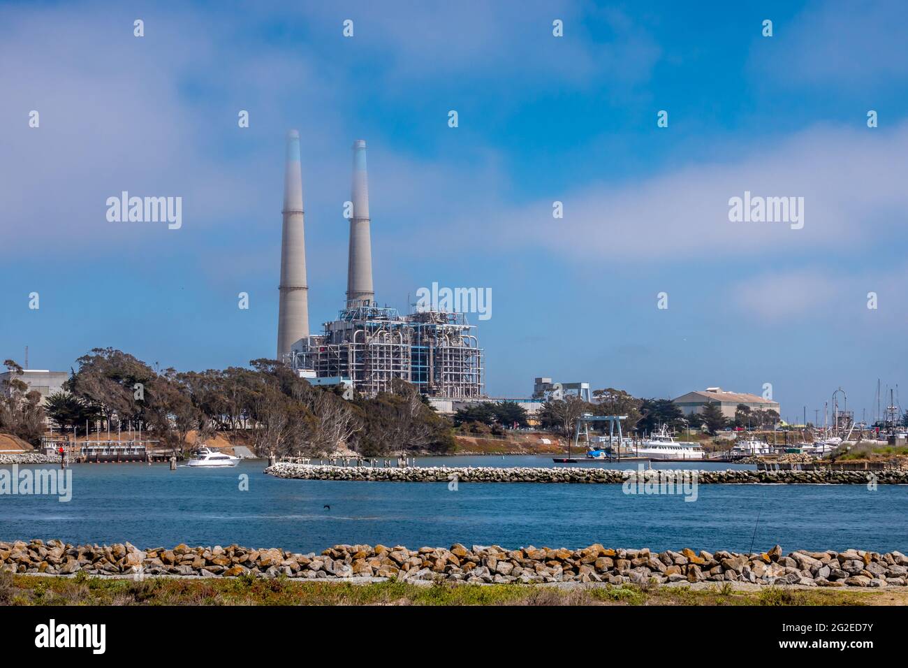 Moss landing power plant with blue sky and white clouds Stock Photo