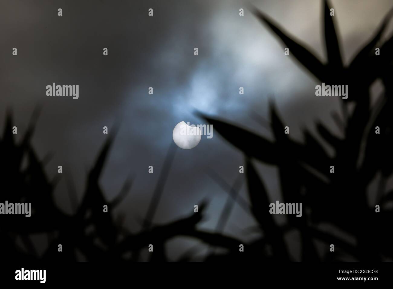 Partial Solar Eclipse seen over London as the moon passes between the ...