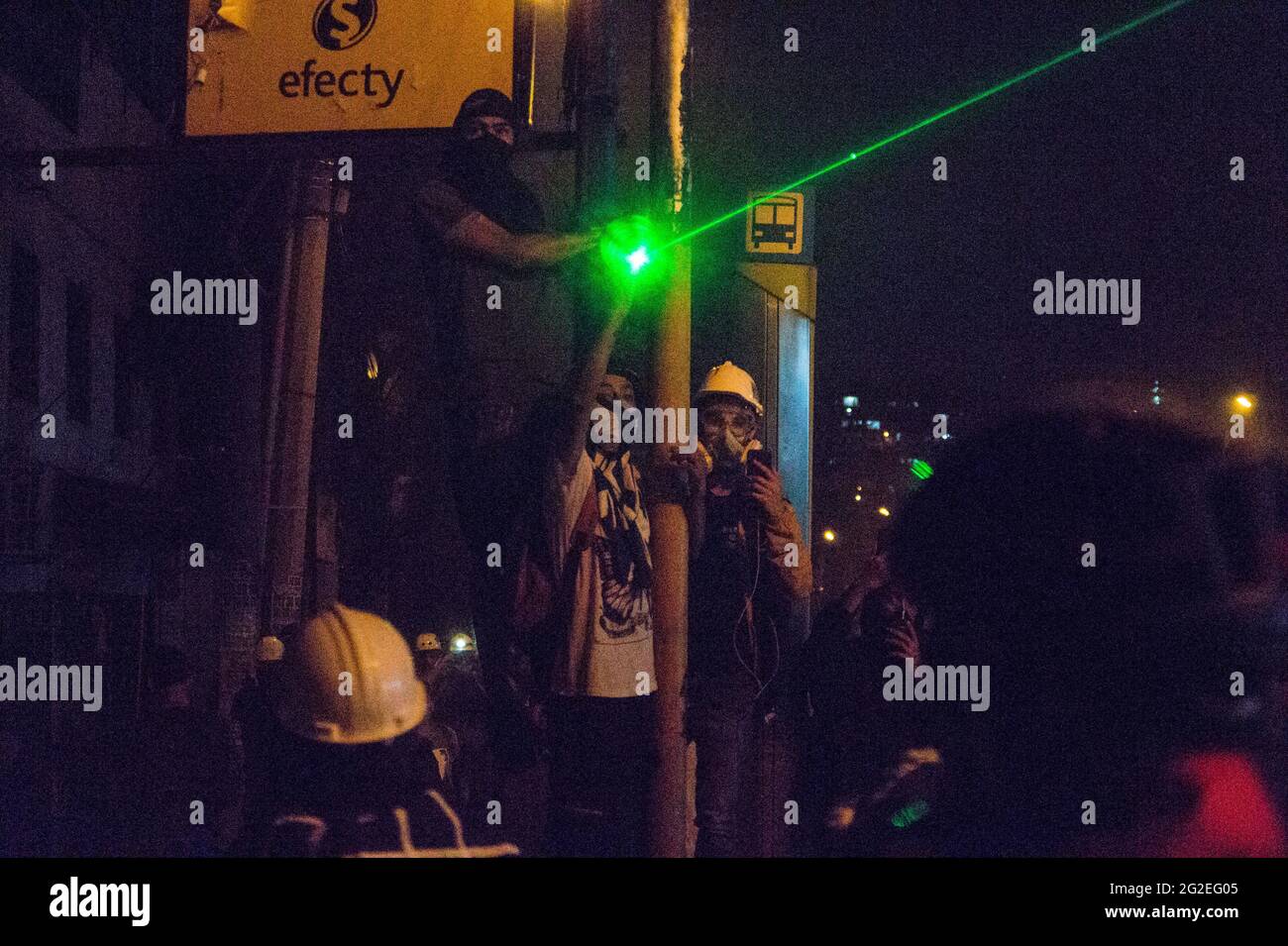 Clashes and unrest between demonstrators using molotov bombs, rocks and lasers with Colombia's riot police as houndreds flooded the streets of medellin in an anti-government protest against the president Ivan Duque, Police Brutality and inequalities, on June 9, 2021, in Medellin, Colombia Stock Photo