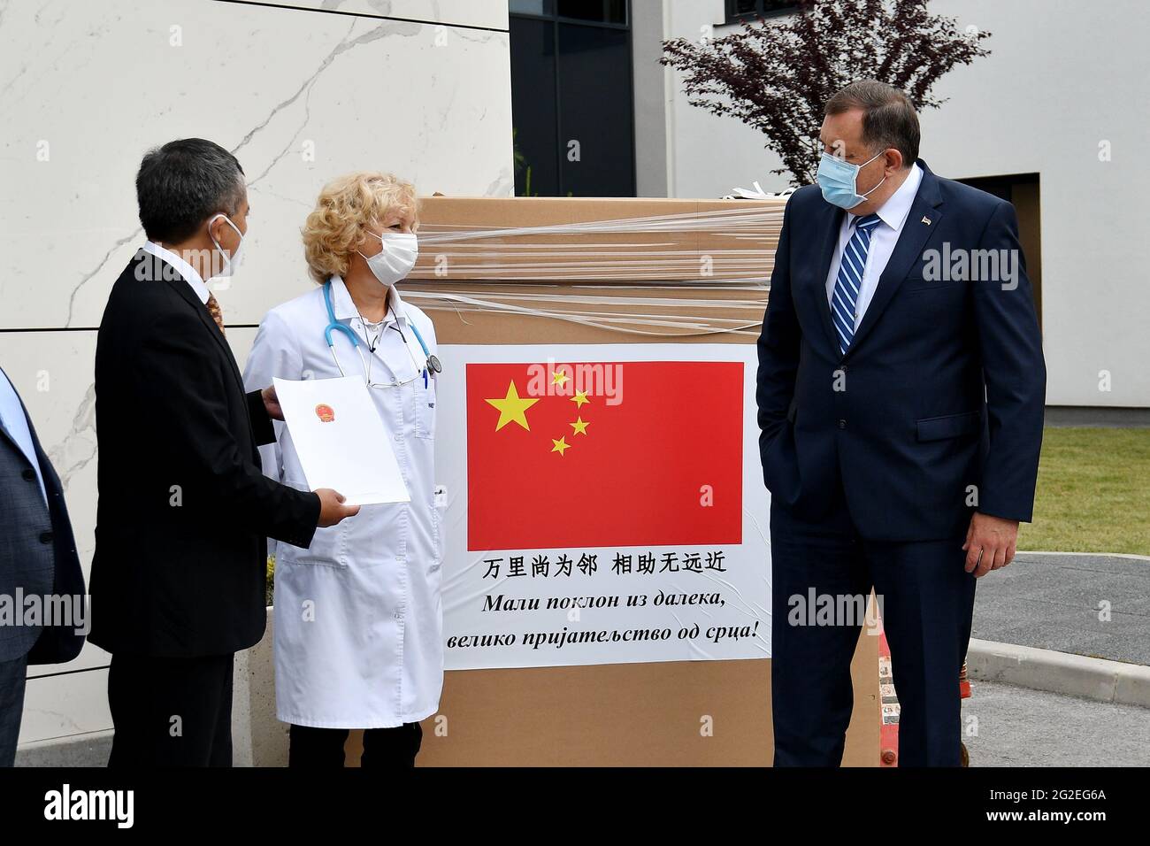 (210611) -- SARAJEVO, June 11, 2021 (Xinhua) -- Milorad Dodik (R), chairman of the Presidency of Bosnia and Herzegovina (BiH), Jadranka Jovovic (C), director of the oncology and hematology department of the Serbian Hospital, and Ji Ping (L), Chinese Ambassador to BiH attend a donation ceremony of a biological safety cabinet (also known as cyto chamber) at the Serbian Hospital, in East Sarajevo, BiH, on June 10, 2021. The Chinese Embassy in BiH on Thursday donated a biological safety cabinet to the Serbian Hospital in East Sarajevo.TO GO WITH 'China donates medical equipment to hospital in BiH' Stock Photo