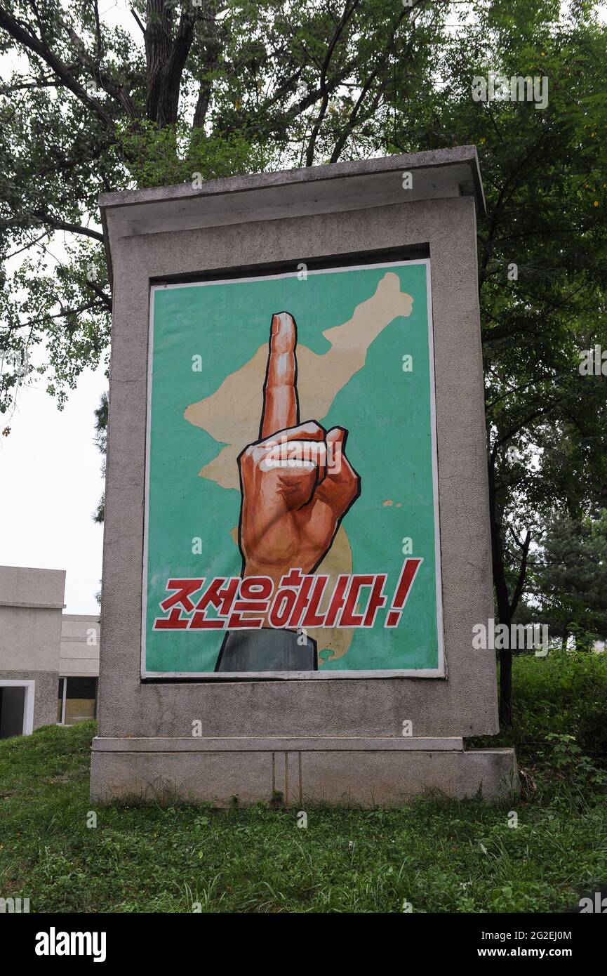 10.08.2012, Panmunjom, North Korea, Asia - A propaganda wall mural made of stone that propagates for the reunification of the two Korean countries. Stock Photo