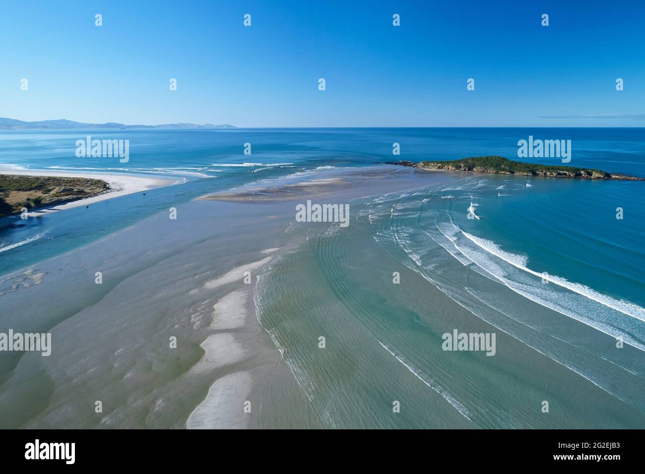 Taieri River, sand bar and Taieri Island / Moturata, Taieri Mouth, near Dunedin, Otago, South Island, New Zealand - drone aerial Stock Photo