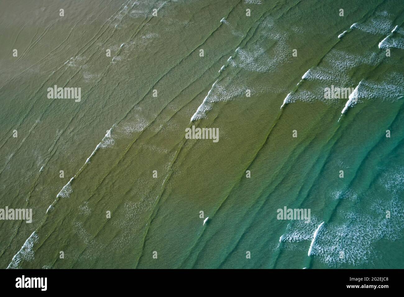 Wave patterns, Taieri Mouth, near Dunedin, Otago, South Island, New Zealand - drone aerial Stock Photo