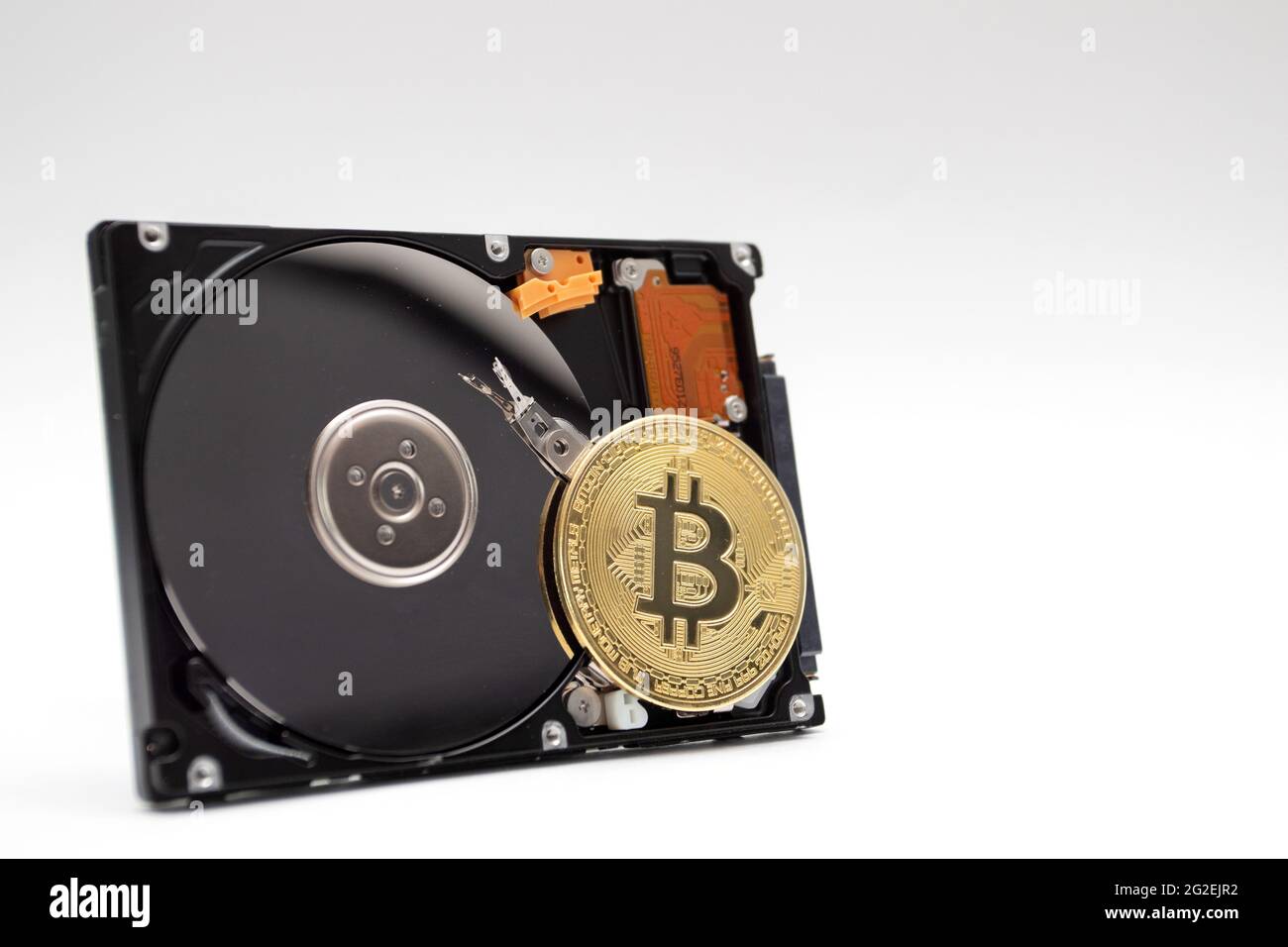 Coin of bitcoin with HDD. Mining Cryptocurrency coin on HDD Stock Photo -  Alamy