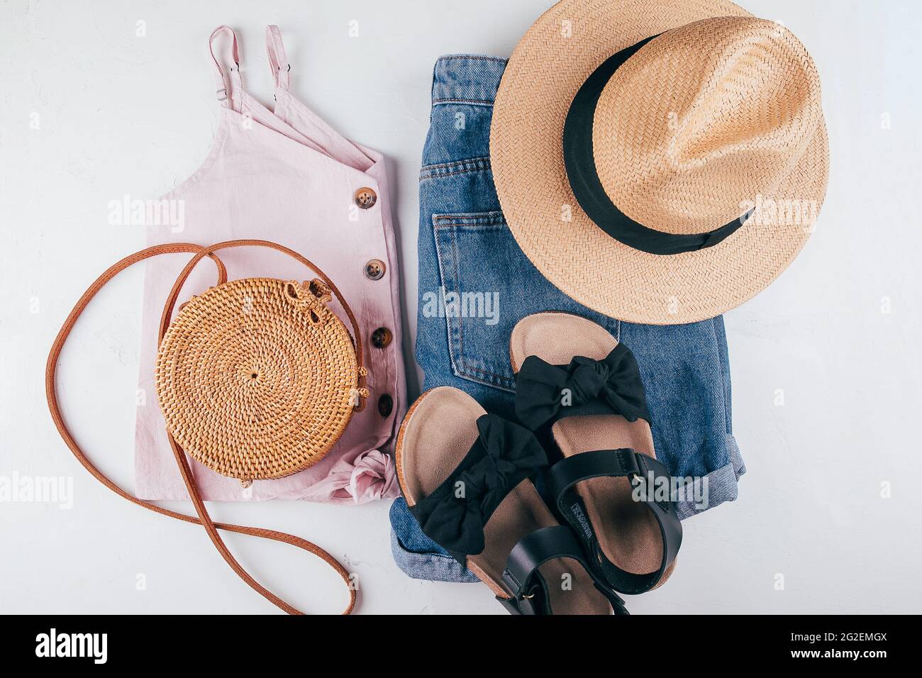 Female fashion outfit - short, top, hat, bag, sandals. Summer holiday clothes. Top view, flat lay Stock Photo
