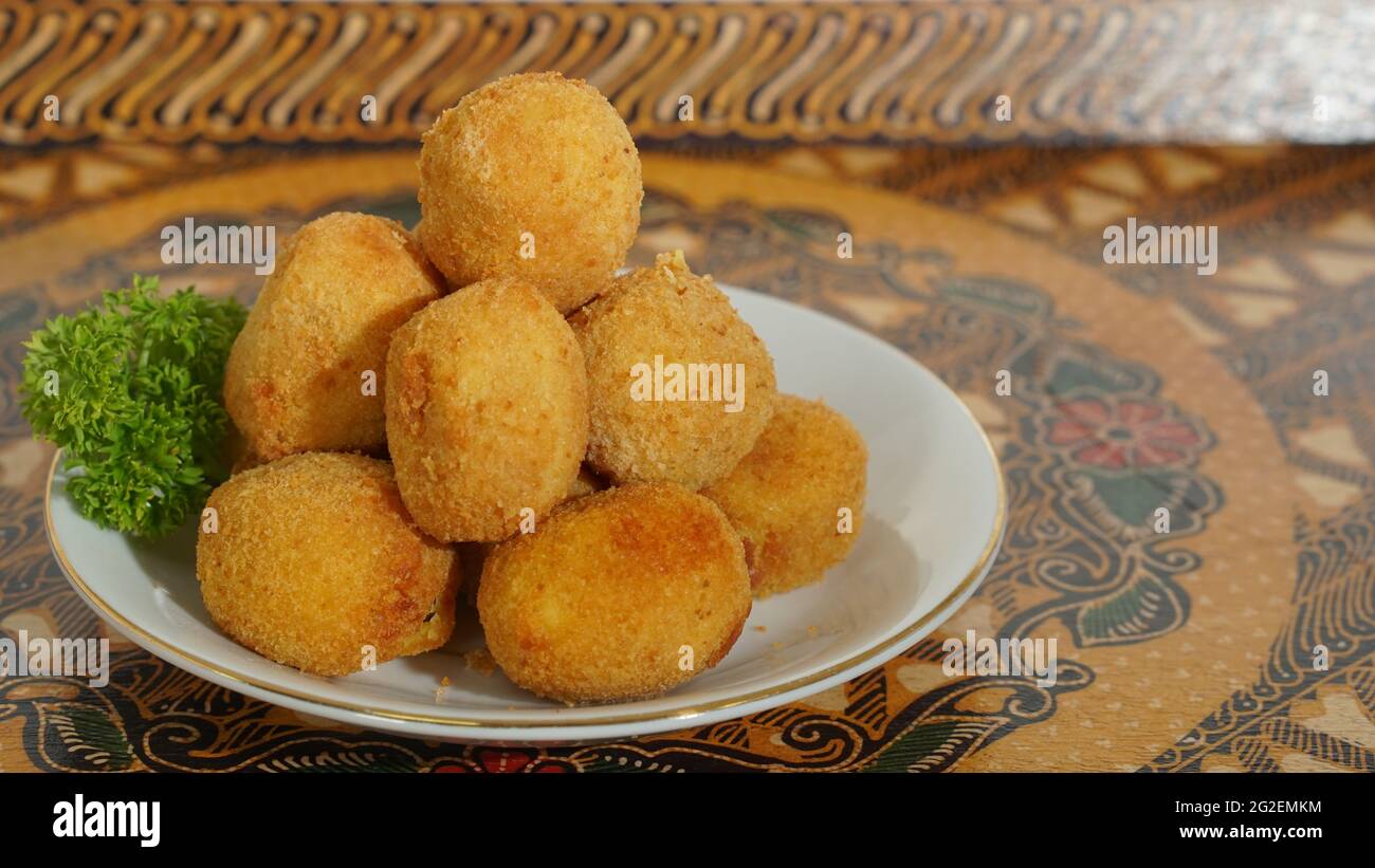 Two Potato Balls Are Partially Eaten With Cheese In The Middle Background, Croquette On White Background, Hd Photography Photo Background Image And Wallpaper for Free Download