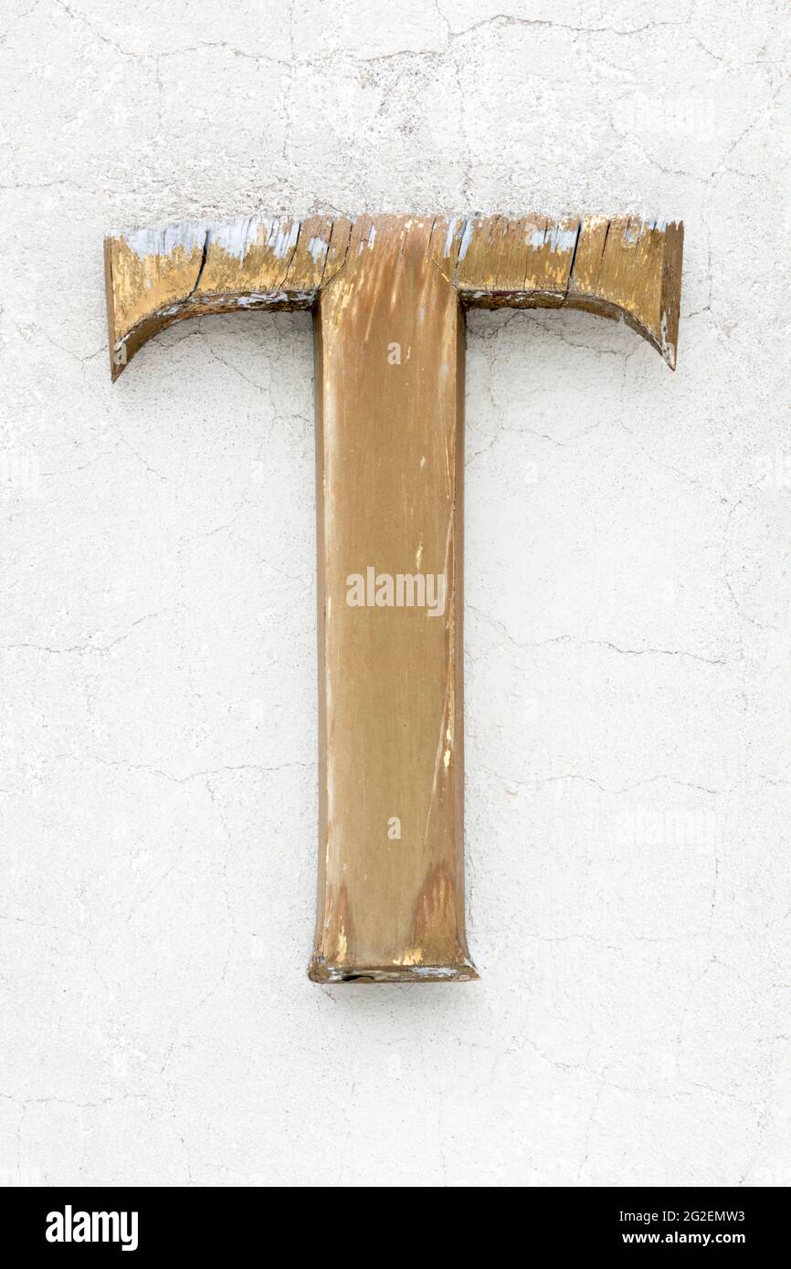 Weathered Wooden Letter T In Golden Colour Stock Photo Alamy