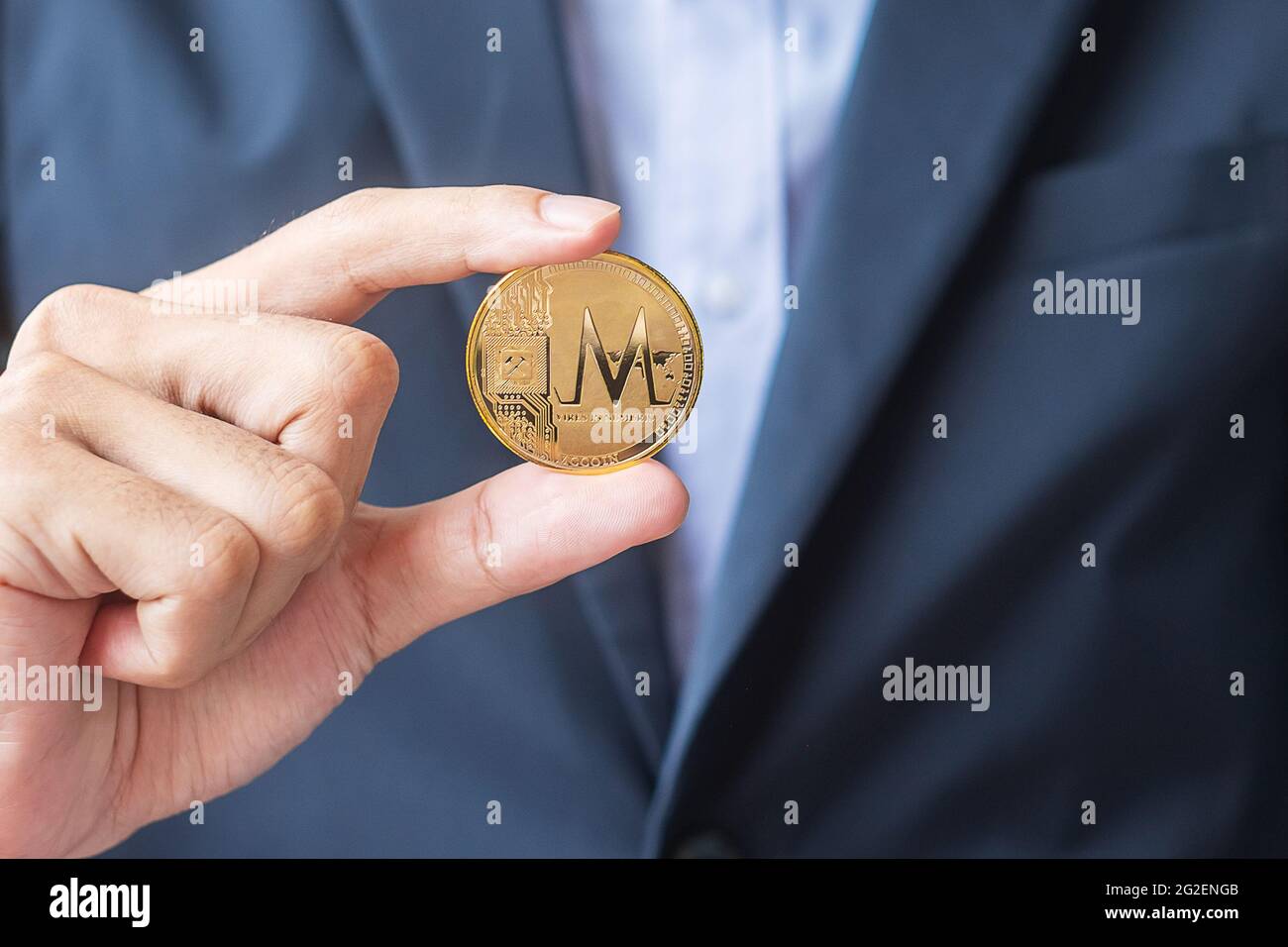 man hand holding gold MCcoin cryptocurrency, Crypto is Digital Money within  the blockchain network, is exchanged using technology and online exchange  Stock Photo - Alamy
