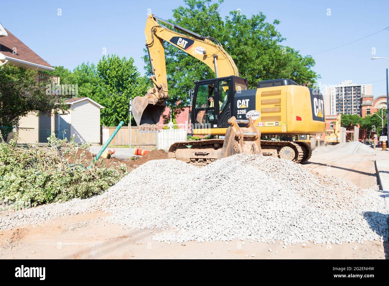 Excavation machine are working on the road along Mulberry street in Hamilton. Stock Photo