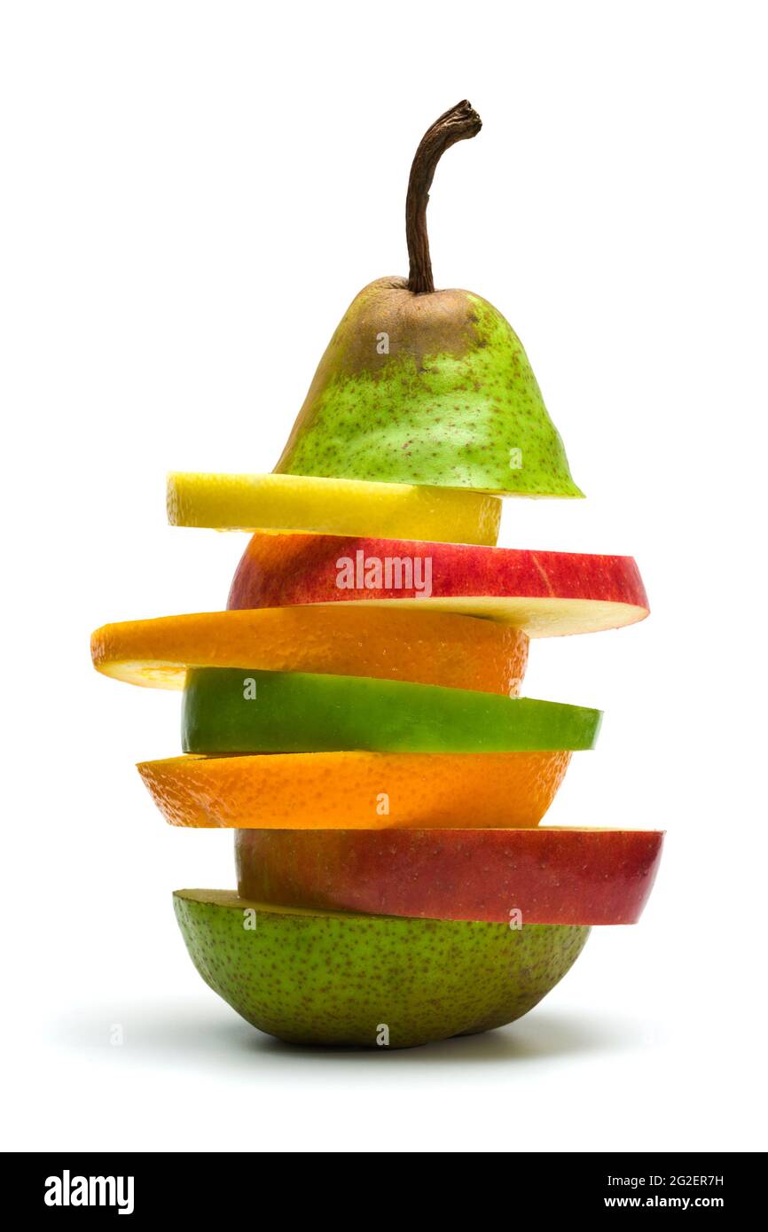 slices of pear, apples, orange, lemon stacked, isolated on white Stock Photo
