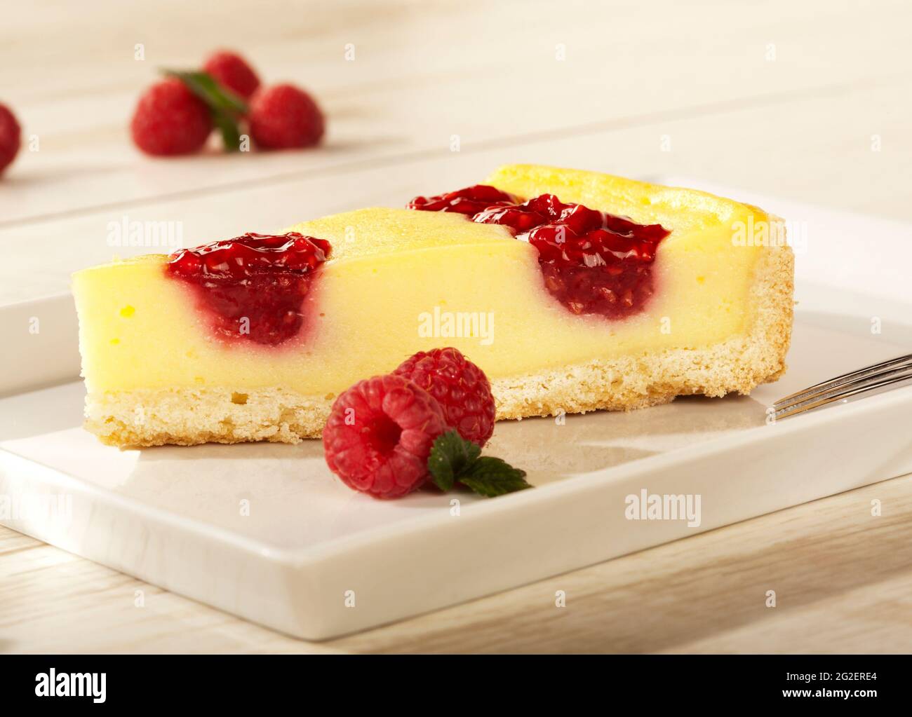 Single piece of raspberry cheesecake, selective focus Stock Photo