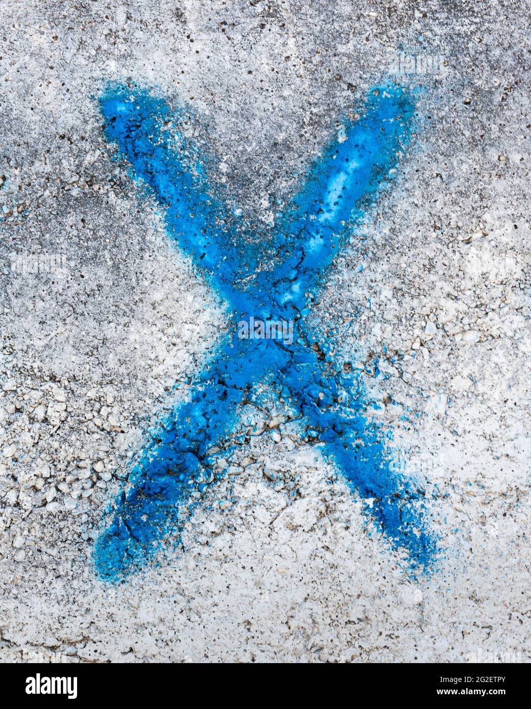 Blue graffiti of the letter X Stock Photo