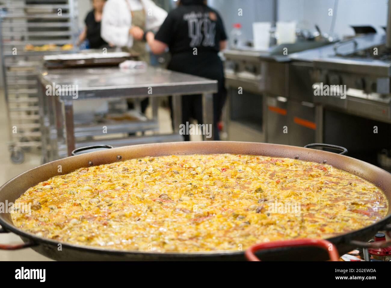 Closeup shot of a traditional Spanish paella in a big brazier Stock