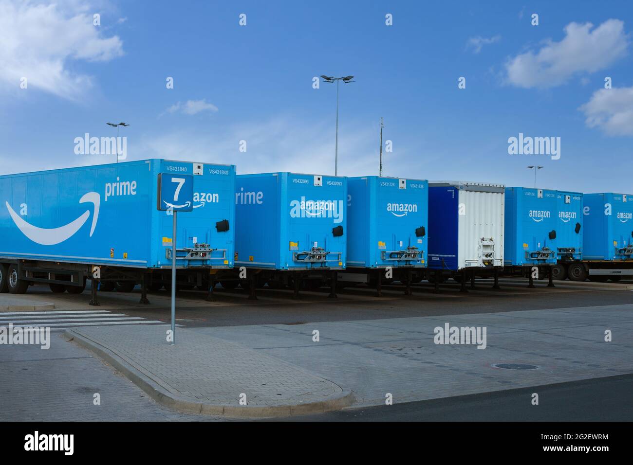 Poland, Sady - May 05, 2021: Amazon trailers parked in the parking lot next to the warehouses. LOGISTICS Stock Photo