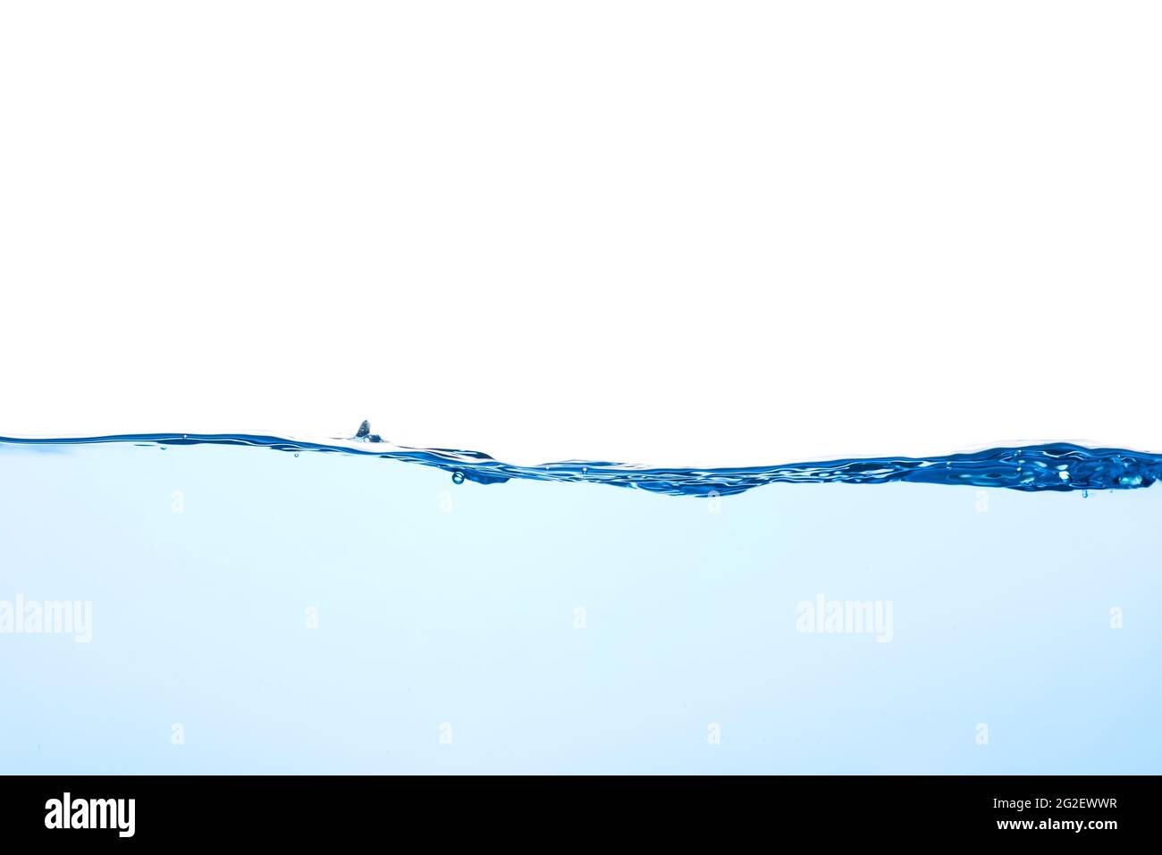 Light blue water wave with air bubbles and a little bit splashed underwater, studio shot