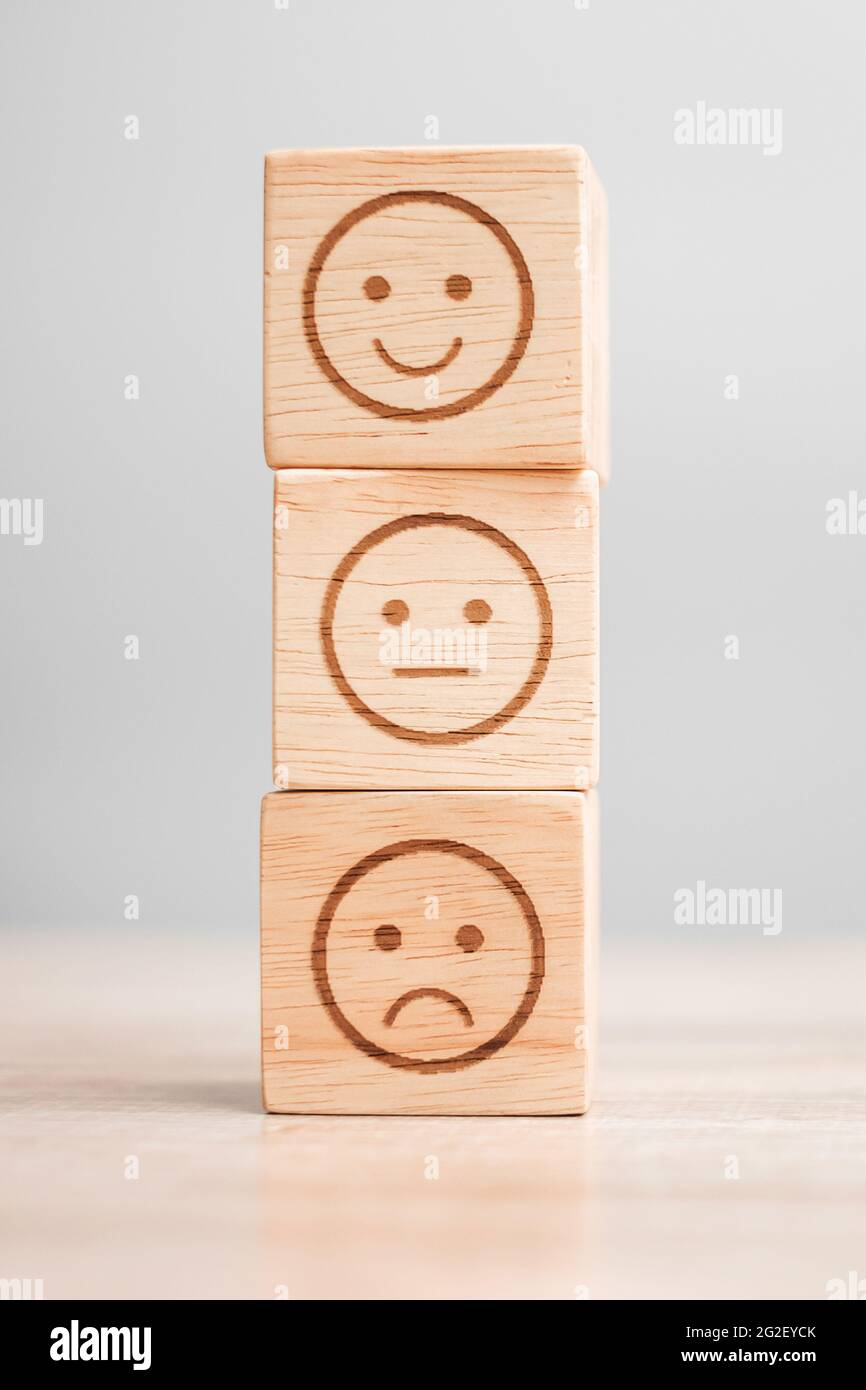 emotion face symbol on wooden blocks. Service rating, ranking, customer ...