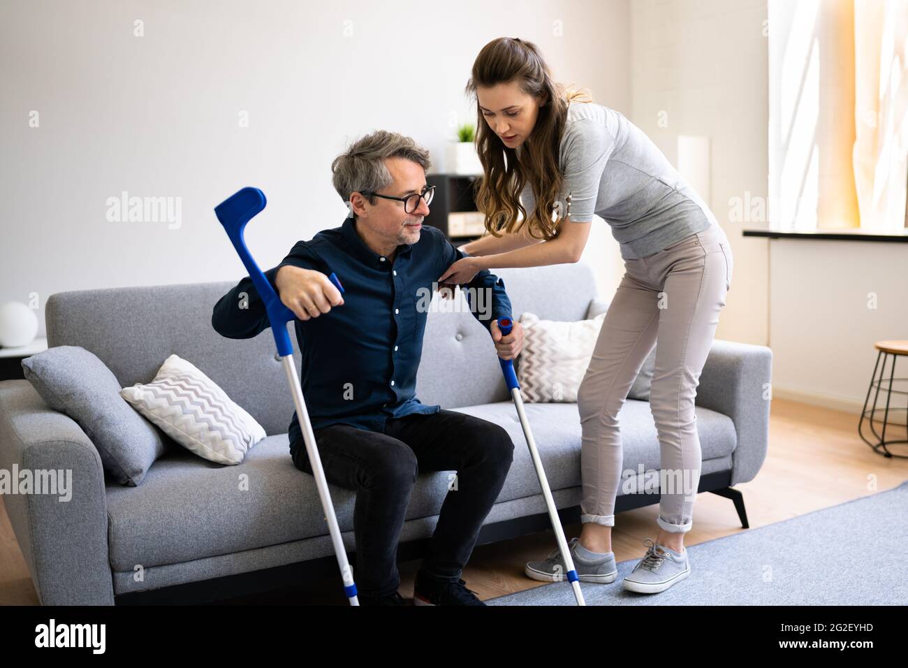 Helping woman man hi-res stock photography and images - Alamy