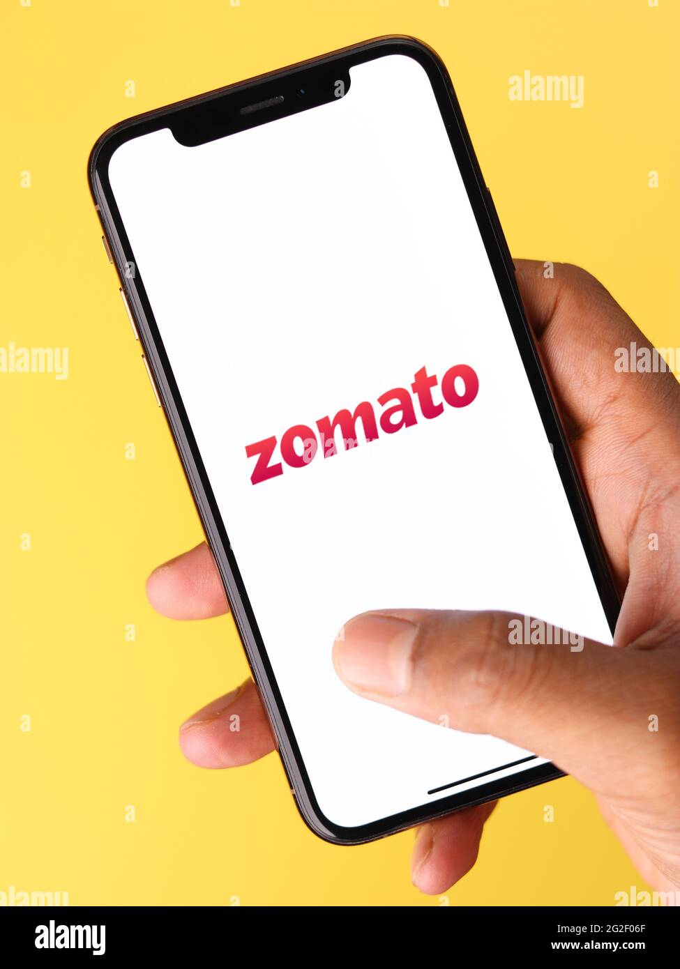 Assam, india - June 7, 2021 : Zomato logo on phone screen stock image. Stock Photo