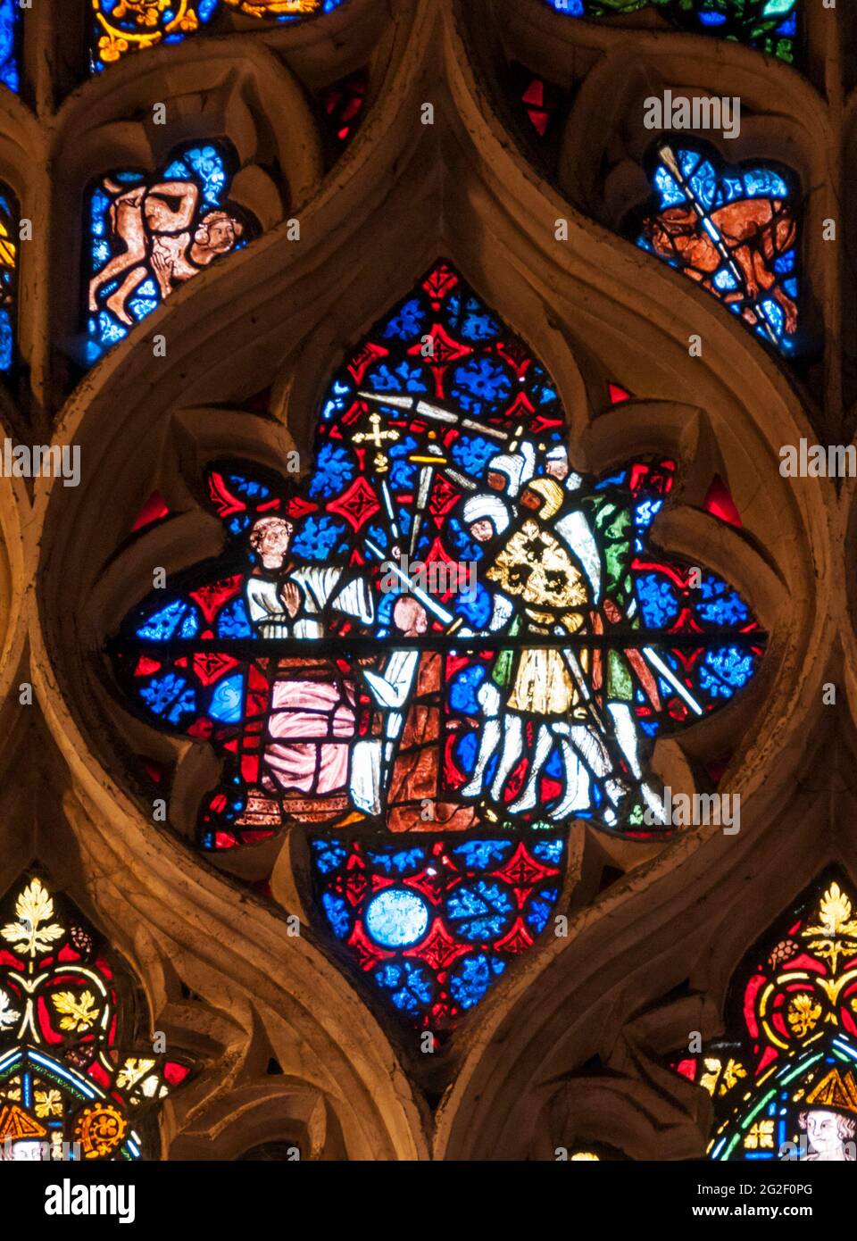 Detail of 1320 Becket stained glass window in Christ Church Cathedral, Oxford. Shows death of Becket - facial features removed by order of Henry VIII. Stock Photo
