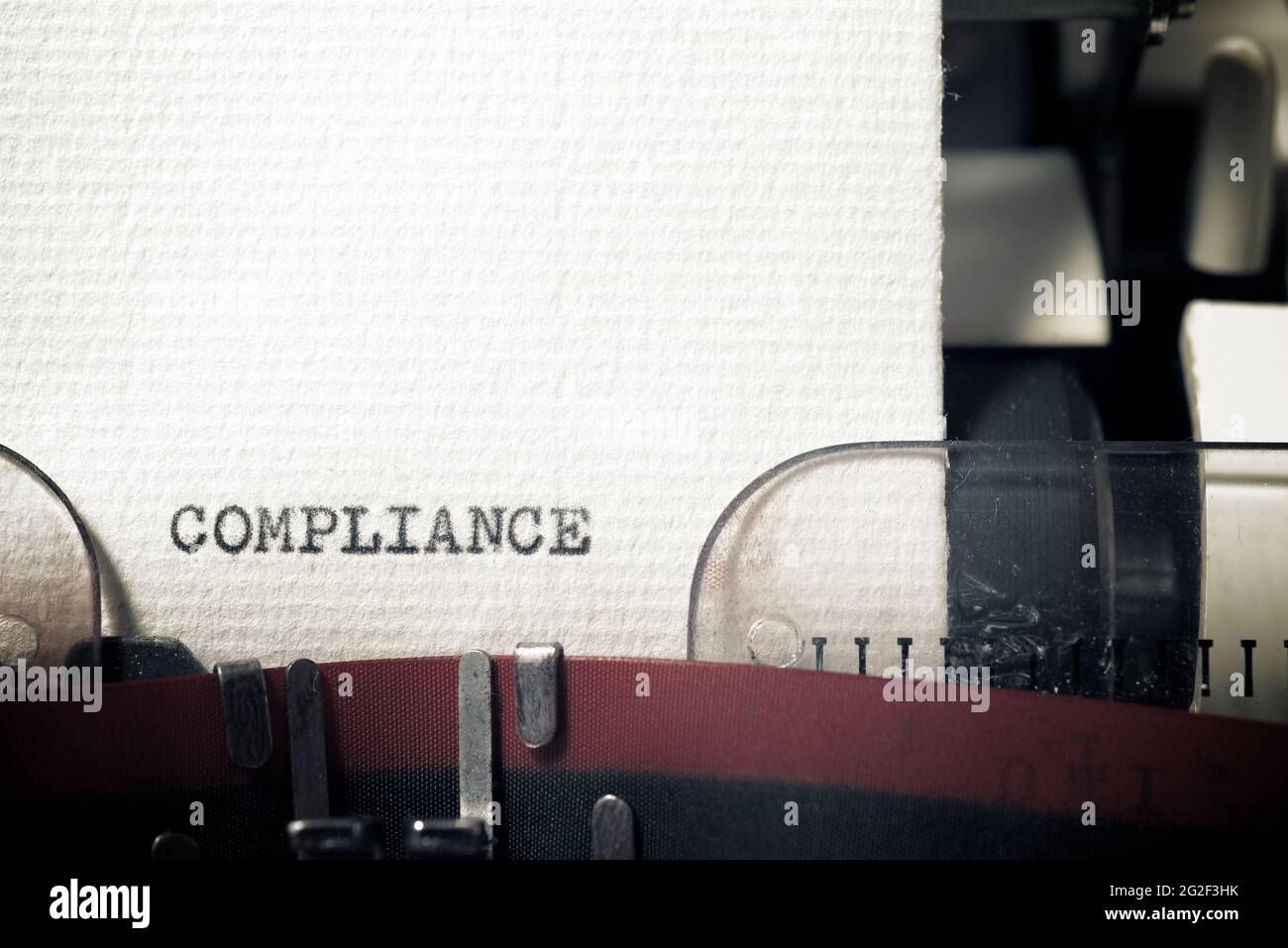 The word compliance written with a typewriter Stock Photo - Alamy
