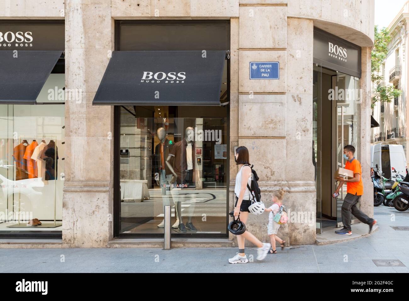 Valencia, Spain. 10th June, 2021. People wearing facemasks as a precaution  against the spread of covid-19 walk past the Hugo Boss store. (Photo by  Xisco Navarro Pardo/SOPA Images/Sipa USA) Credit: Sipa USA/Alamy