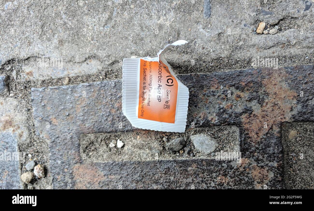 26 May 2019, Swansea, Wales. Two  Used NeverShare Heroin Syringe with Vomit. Real life scenario.Drug overdose and opioid epidemic.  drugs Addiction Stock Photo