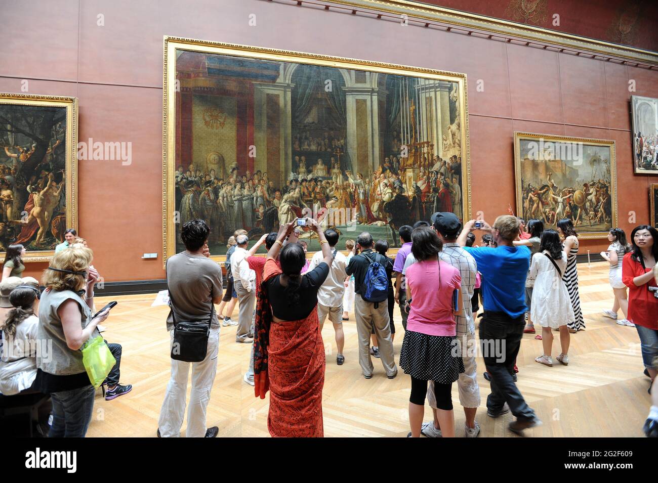 The Louvre art gallery Paris France. French arts painting paintings exhibition tourists visitors people visiting europe european tourism culture Stock Photo