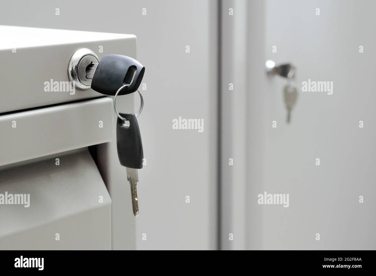 key in office cabinet lock with copy space Stock Photo