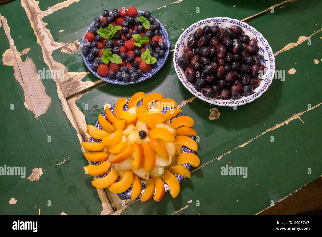 Fruit beautifully arranged on antique plates. --- A weekend at Brooklyn House, Martham Stock Photo