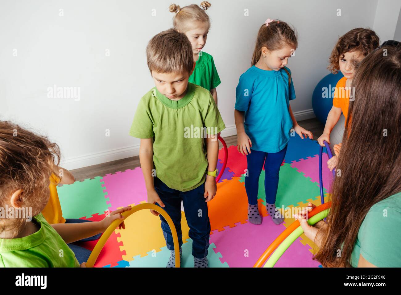 Shy boy learning to interact with kids at daycare Stock Photo Alamy