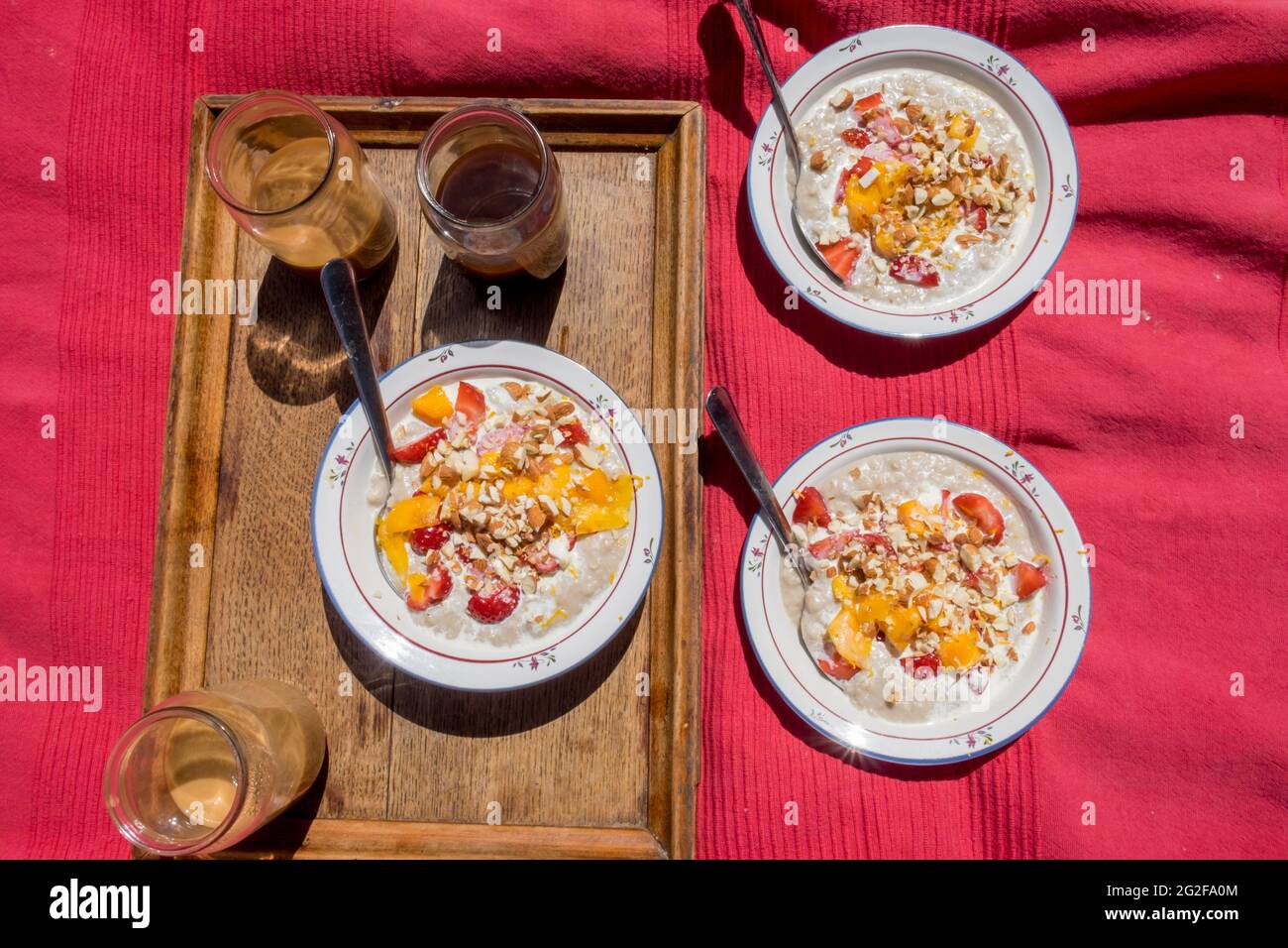 Healthy and delicious porridge made with oat milk and fresh fruit. --- A weekend at Brooklyn House, Martham Stock Photo