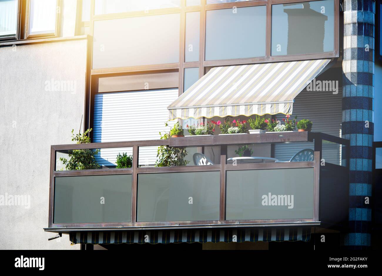 Beautiful apartment building balcony with sushade protection awning