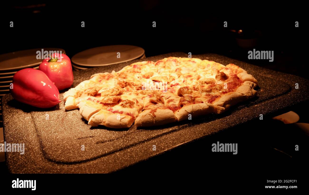 Food presentations at a five star buffet Rain Tree Cafe The Athenee Hotel in Bangkok Thailand pizza appizza  Italian hot bread with sauce Stock Photo