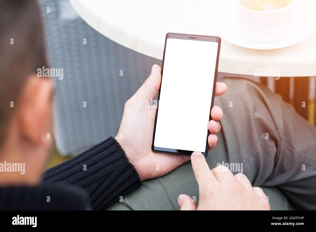 Using Mobile Stock Photo Close up of man's hands holding mobile smart phone with blank copy ...