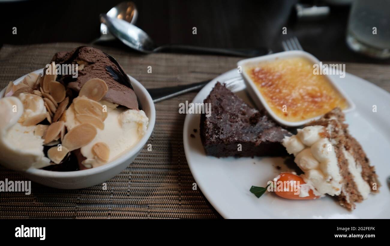 Deserts after meal sweet treat goodies Eating Out five star casual dinning Buffet J W Cafe  sweets after dinner the end of a meal Stock Photo