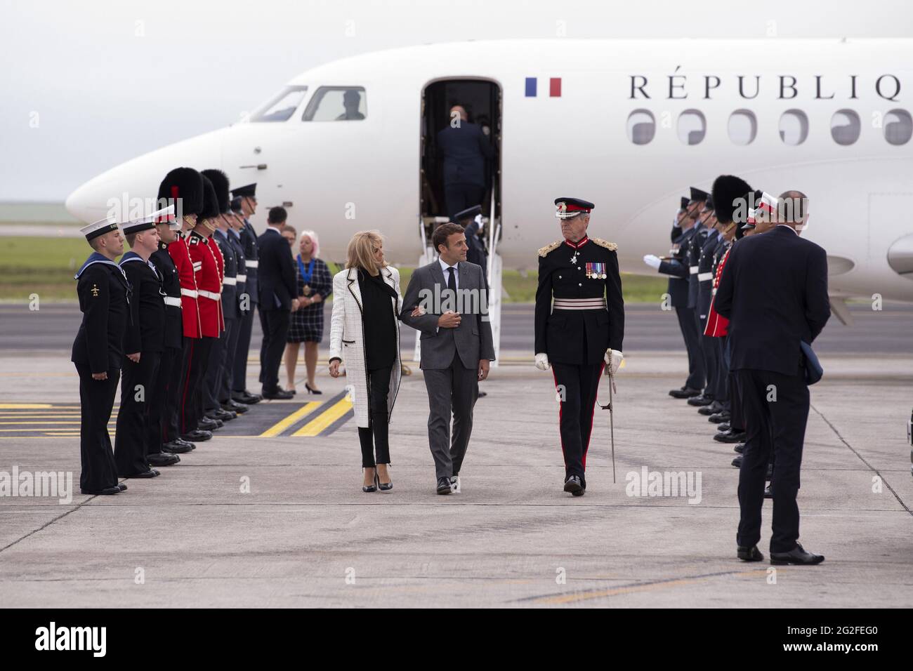 Newquay, UK. 11th June, 2021. President of France Emmanuel Macron and his wife Brigitte Macron arrive at Cornwall Airport Newquay on June 11, 2021, ahead of the G7 summit in Cornwall. Photo by Doug Peters/G7 Cornwall 2021/UPI Credit: UPI/Alamy Live News Stock Photo
