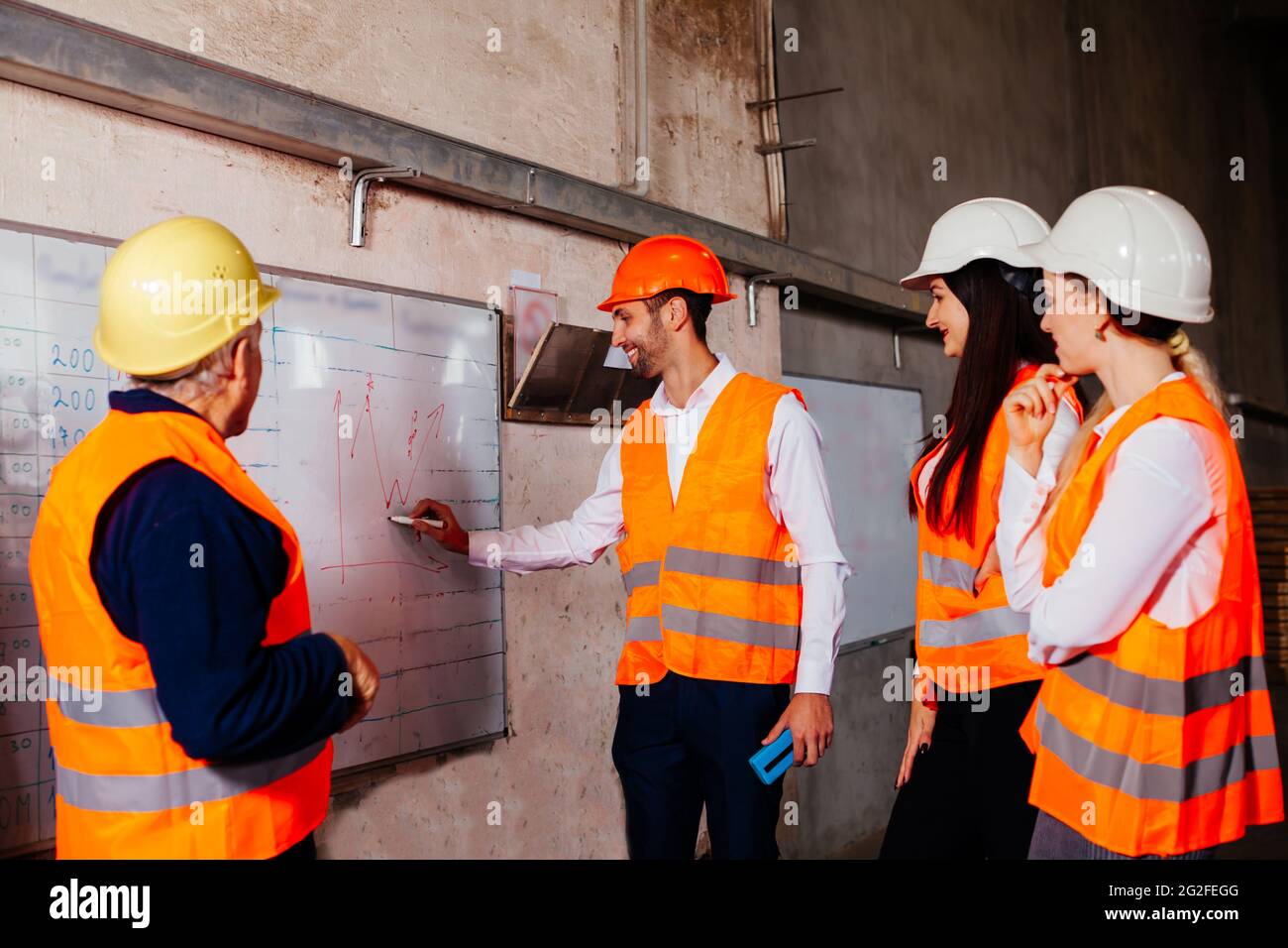 The young engineers are practicing at the factory Stock Photo - Alamy