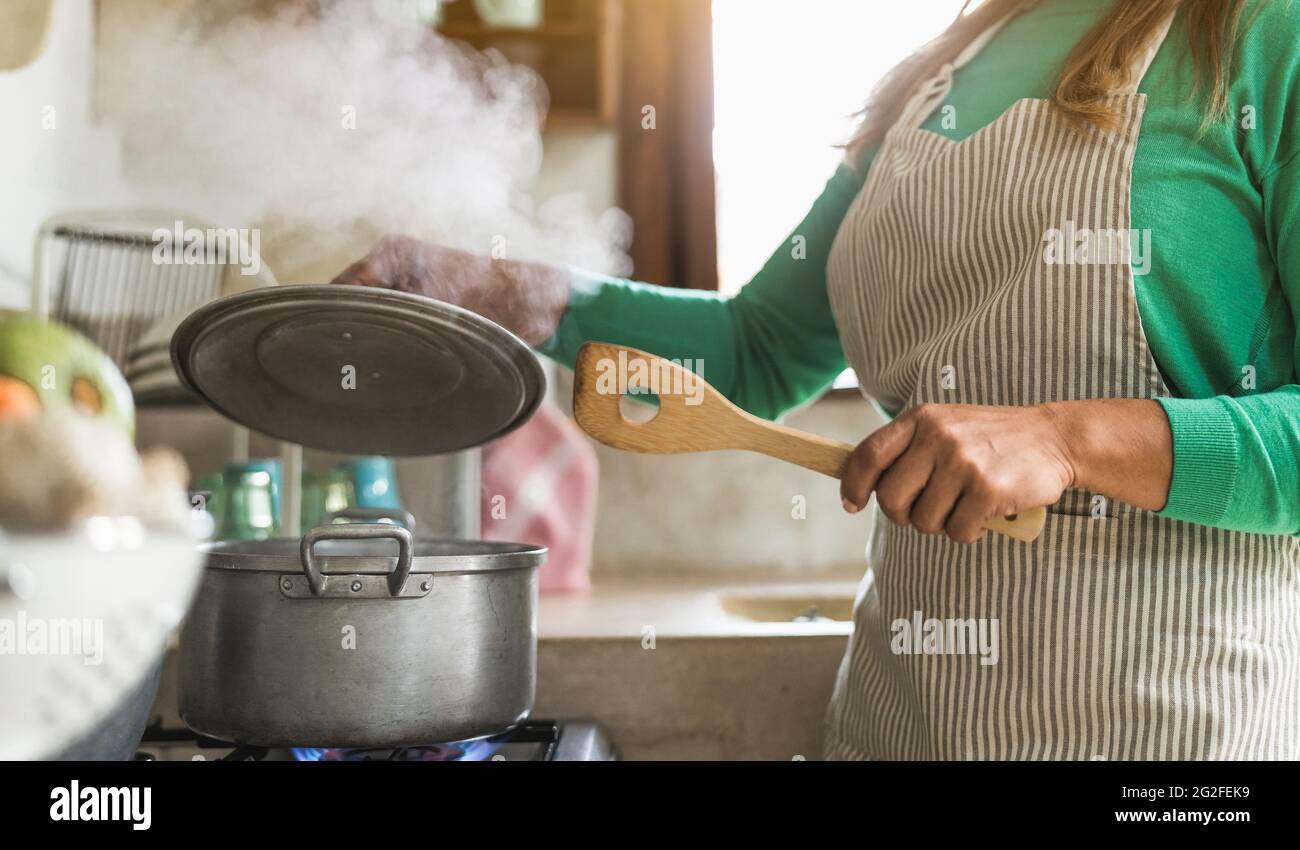 Mature woman cooking kitchen hi-res stock photography and images - Alamy