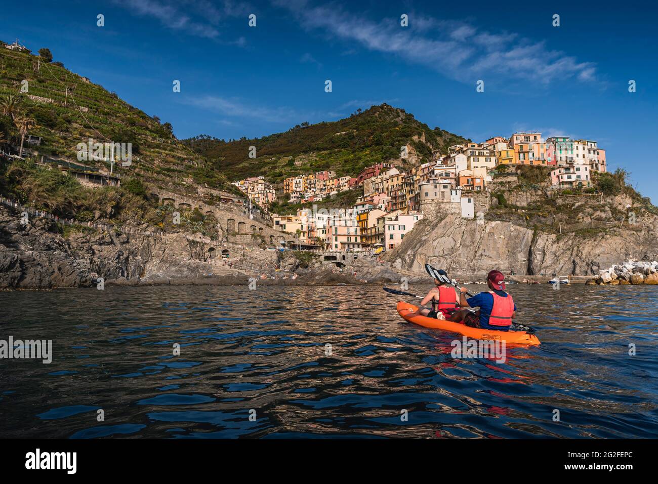 Kayaking in front of manarola in the cinque terre Stock Photo