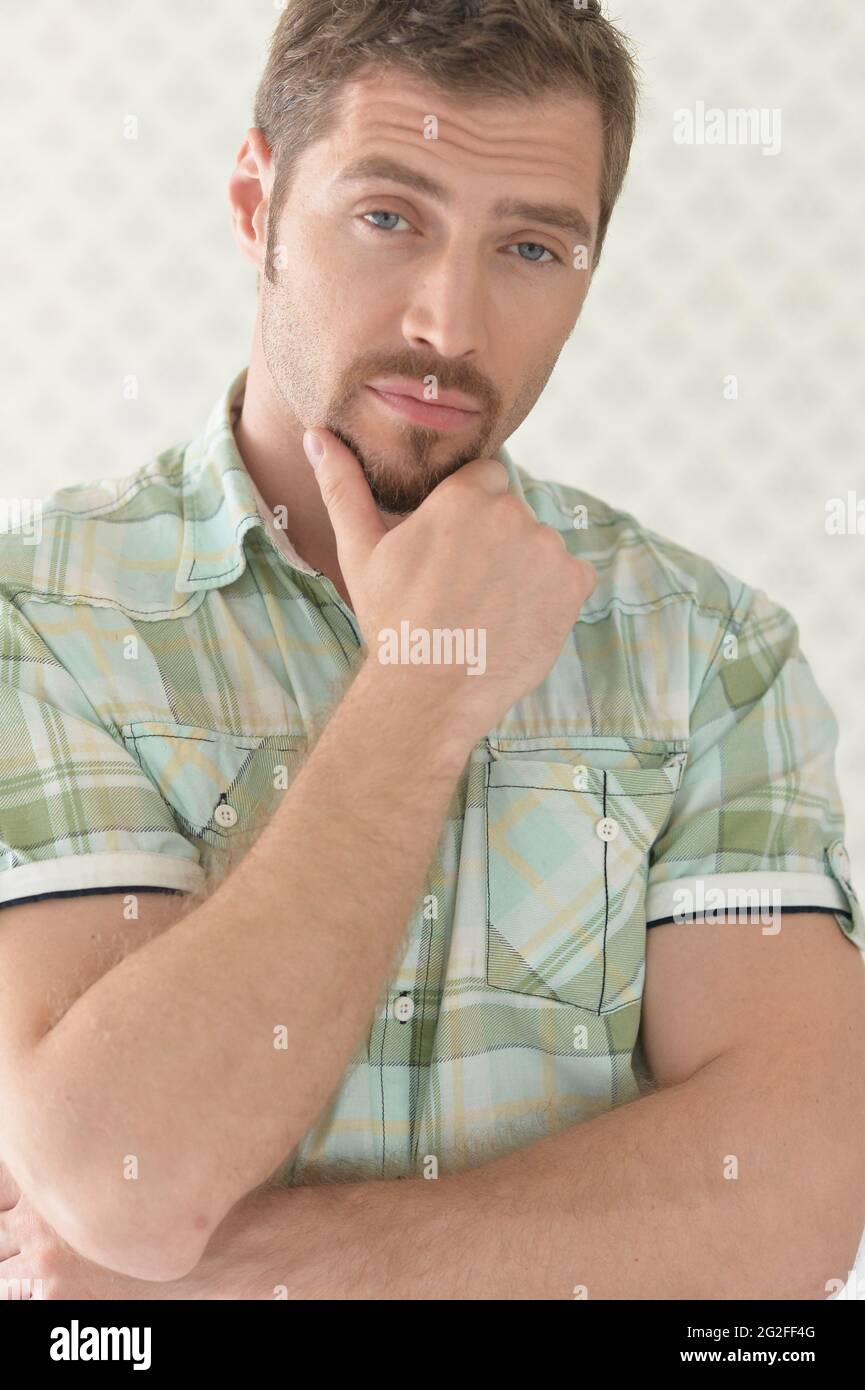 Young man posing in studio hi-res stock photography and images - Alamy
