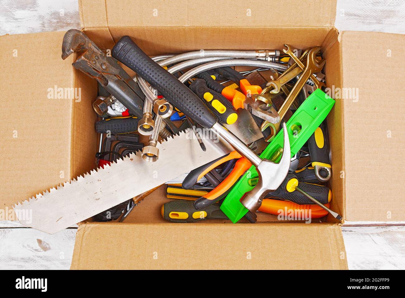 top view of various handyman tools in cardboard box Stock Photo