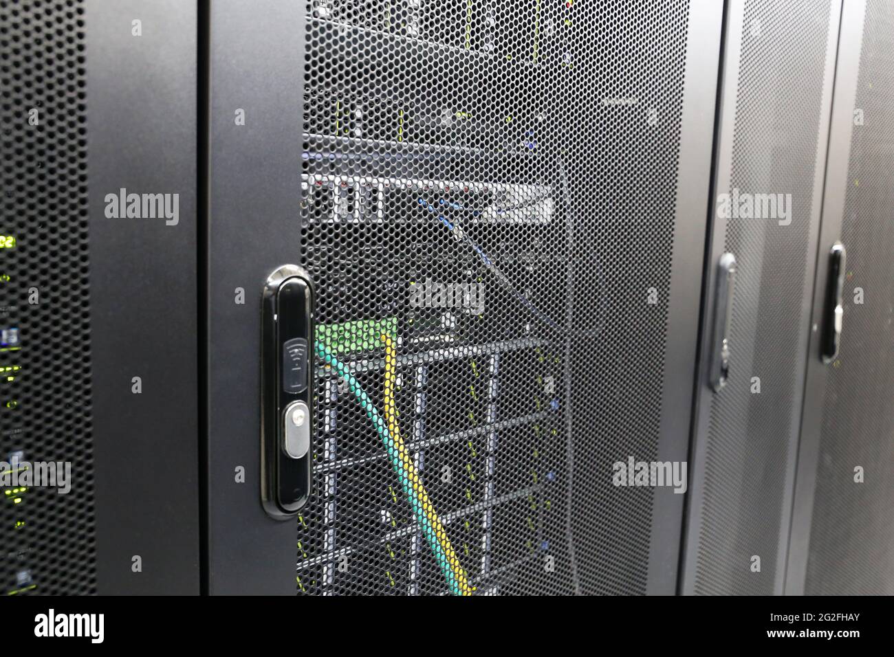 Electronic lock on server rack in data center. Server room, computer network security Stock Photo