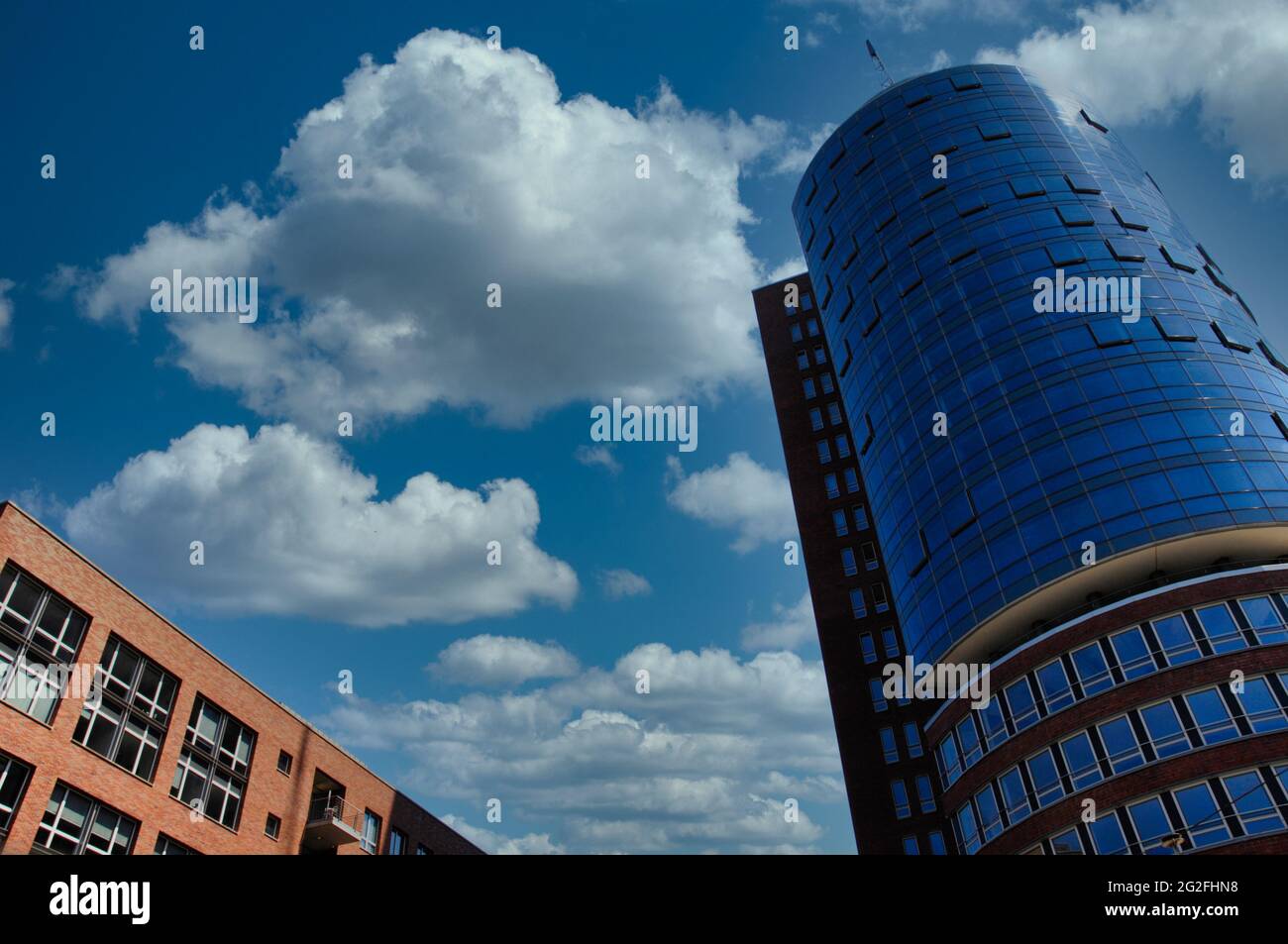 Low angle shot of the facade of an old and a modern building under the ...