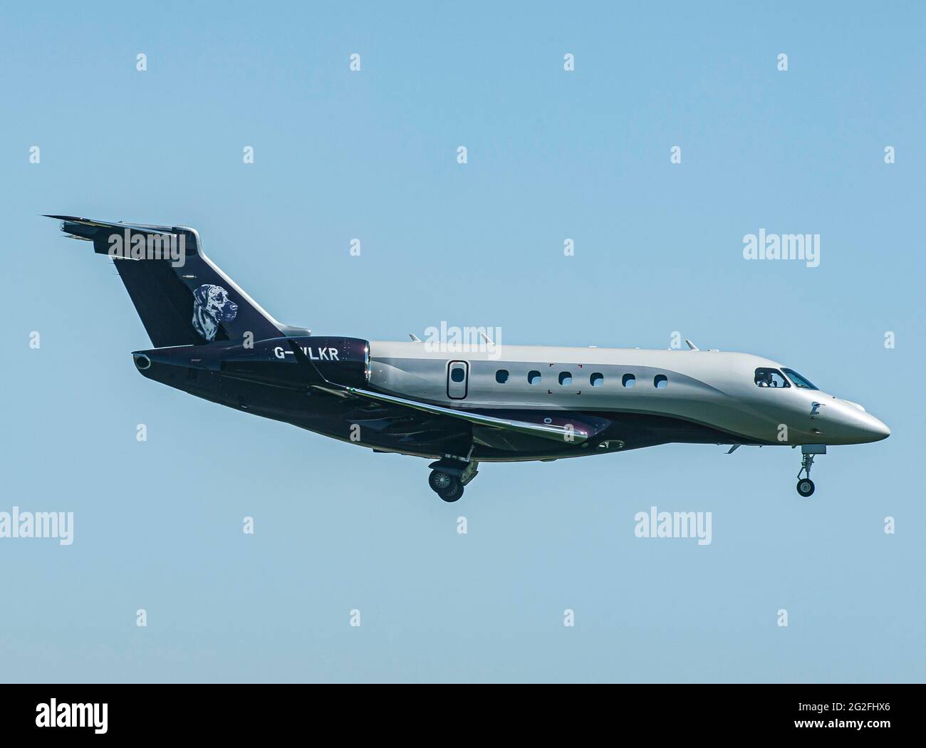 An Air Charter Scotland Airline Embraer EMB-550Legacy arriving  at Inverness Dalcross Airport Stock Photo