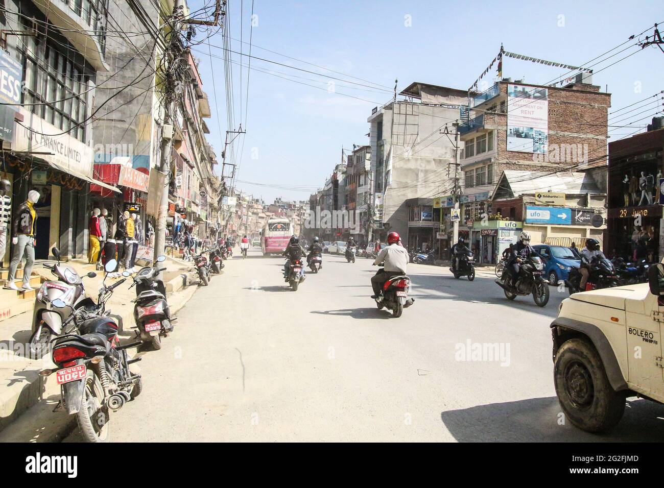 Main road from central Kathmandu to Boudha which is very busy, bumpy and dusty. Stock Photo