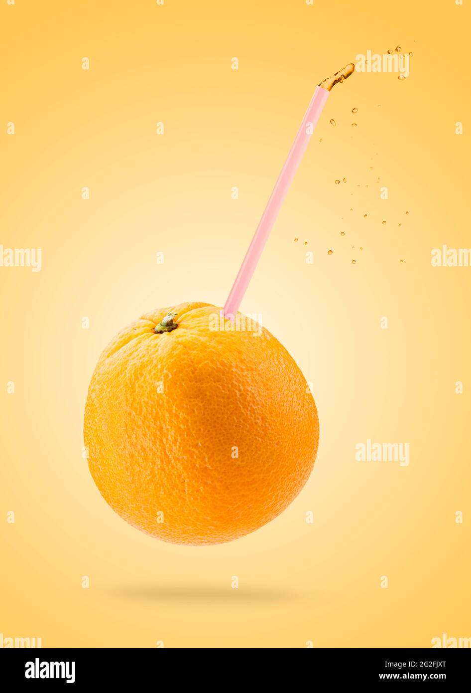 Orange fruit with drinking staw on colored background Stock Photo